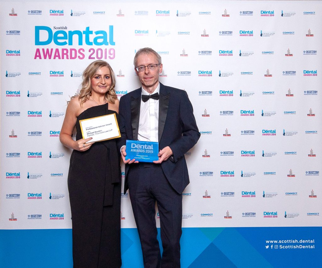 Micheal, with award presenter Jennifer Glenn from Dentsply Sirona