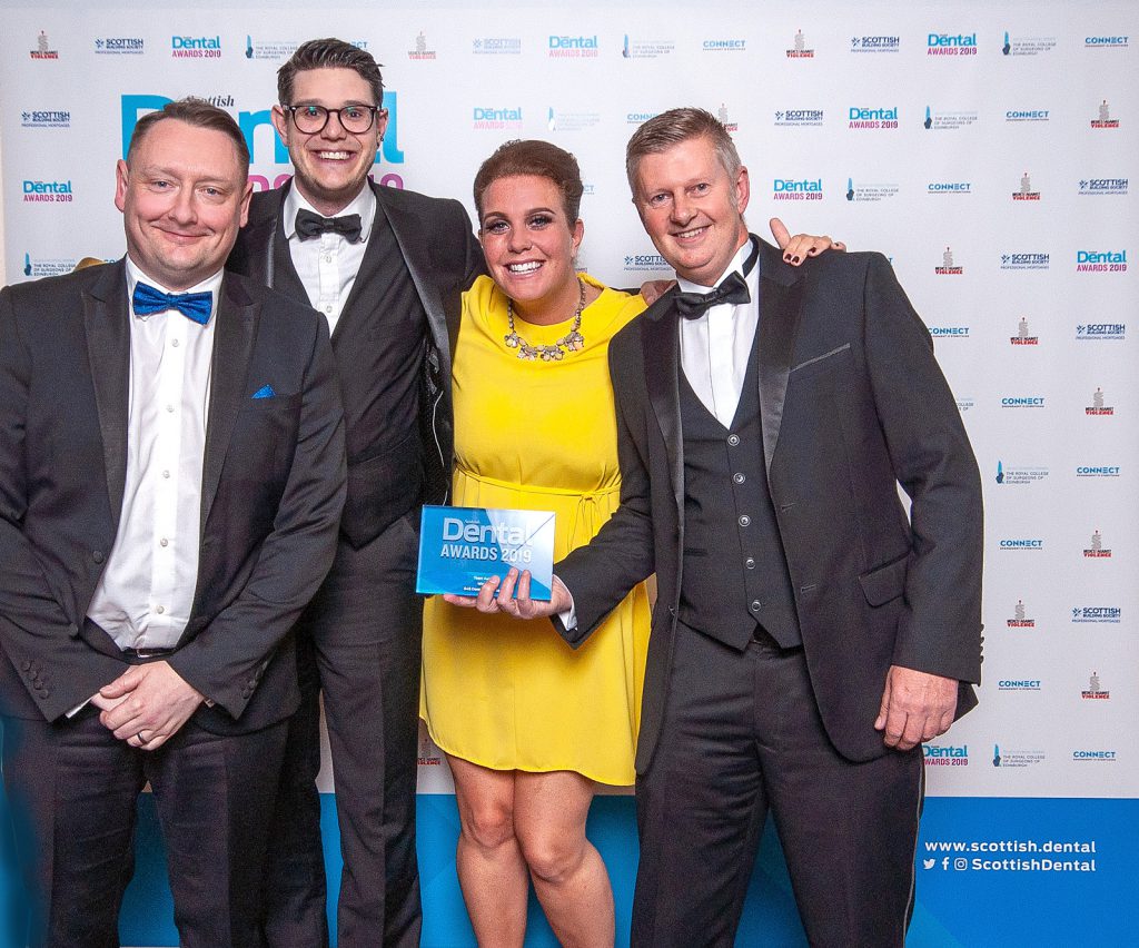 The team from S4S Dental Laboratory celebrating their award